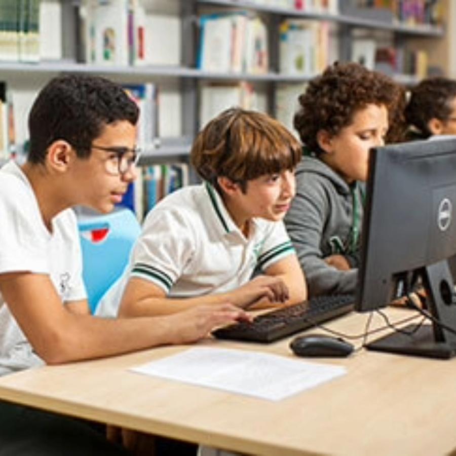 MMS students working on a school computer