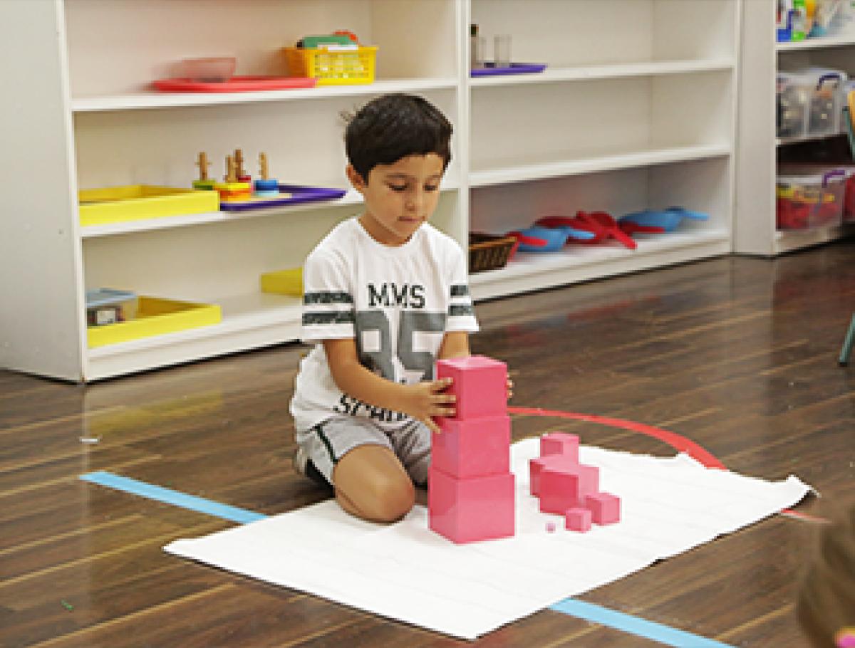 Student using building blocks in the classroom